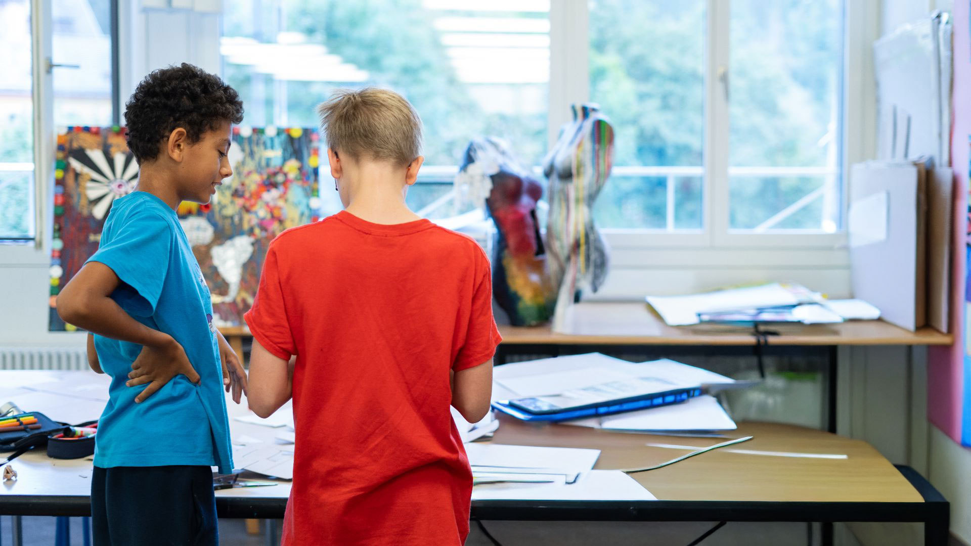 photo of two ISSH students talking to each other