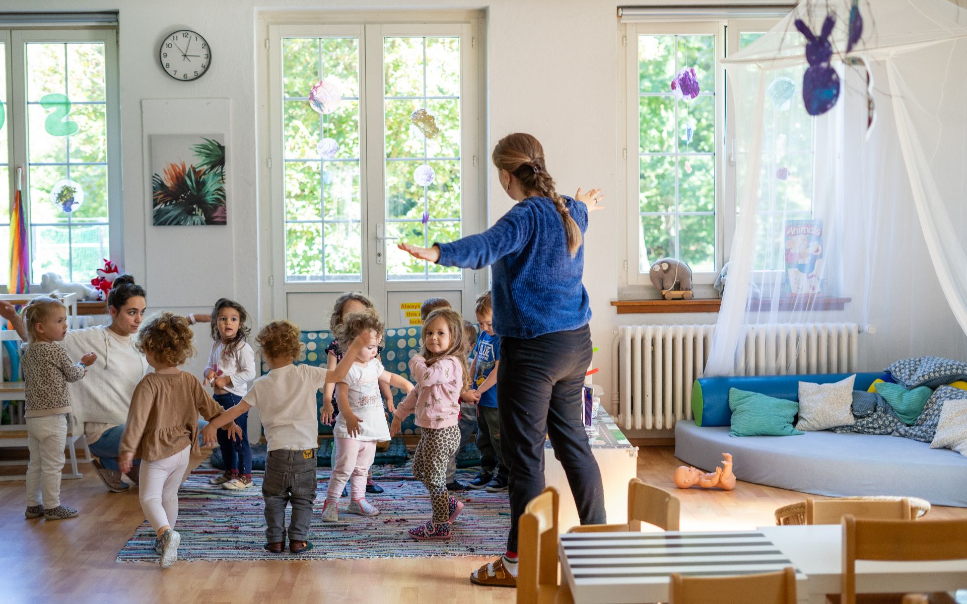 photo of an early years classroom and ISSH students and their tutor