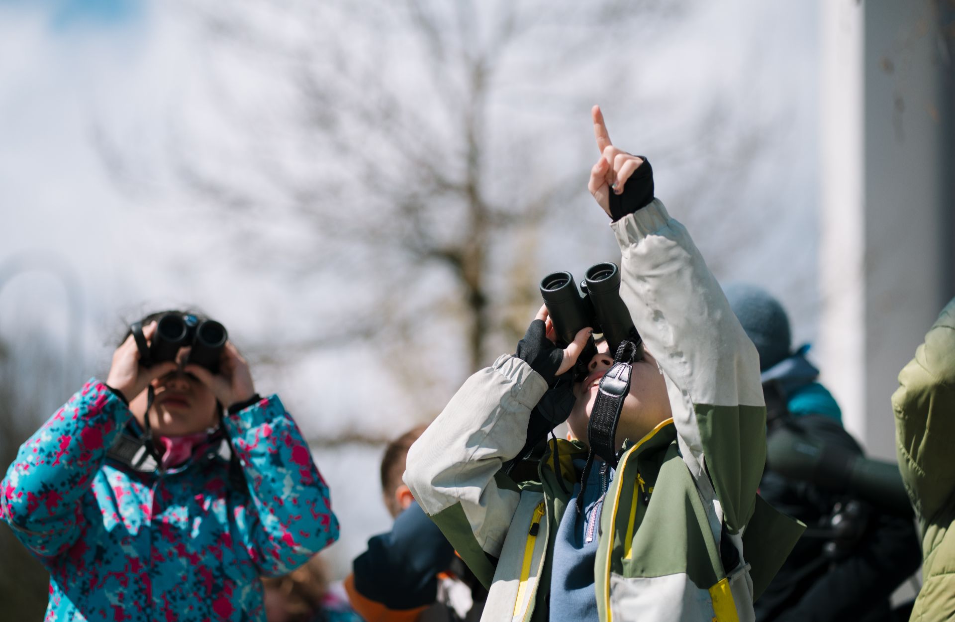 photo of young issh students outside bird watching